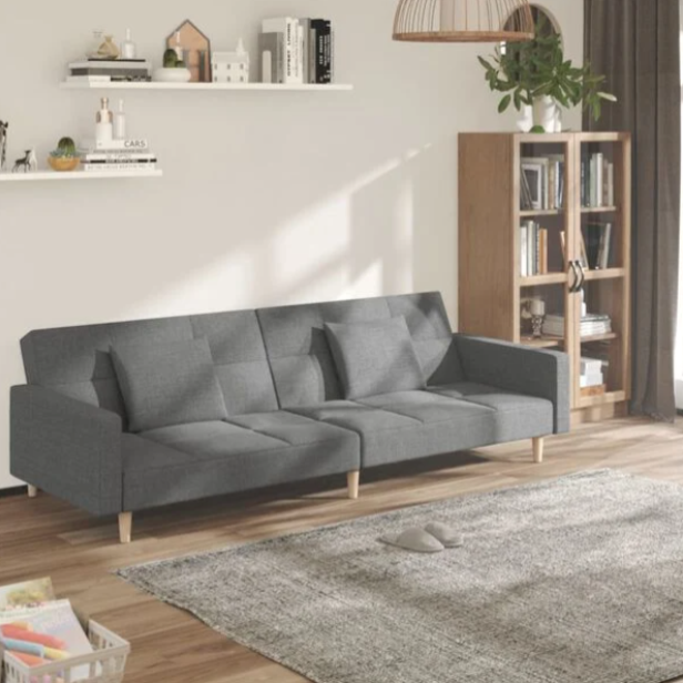Canapé convertible en tissu avec oreillers